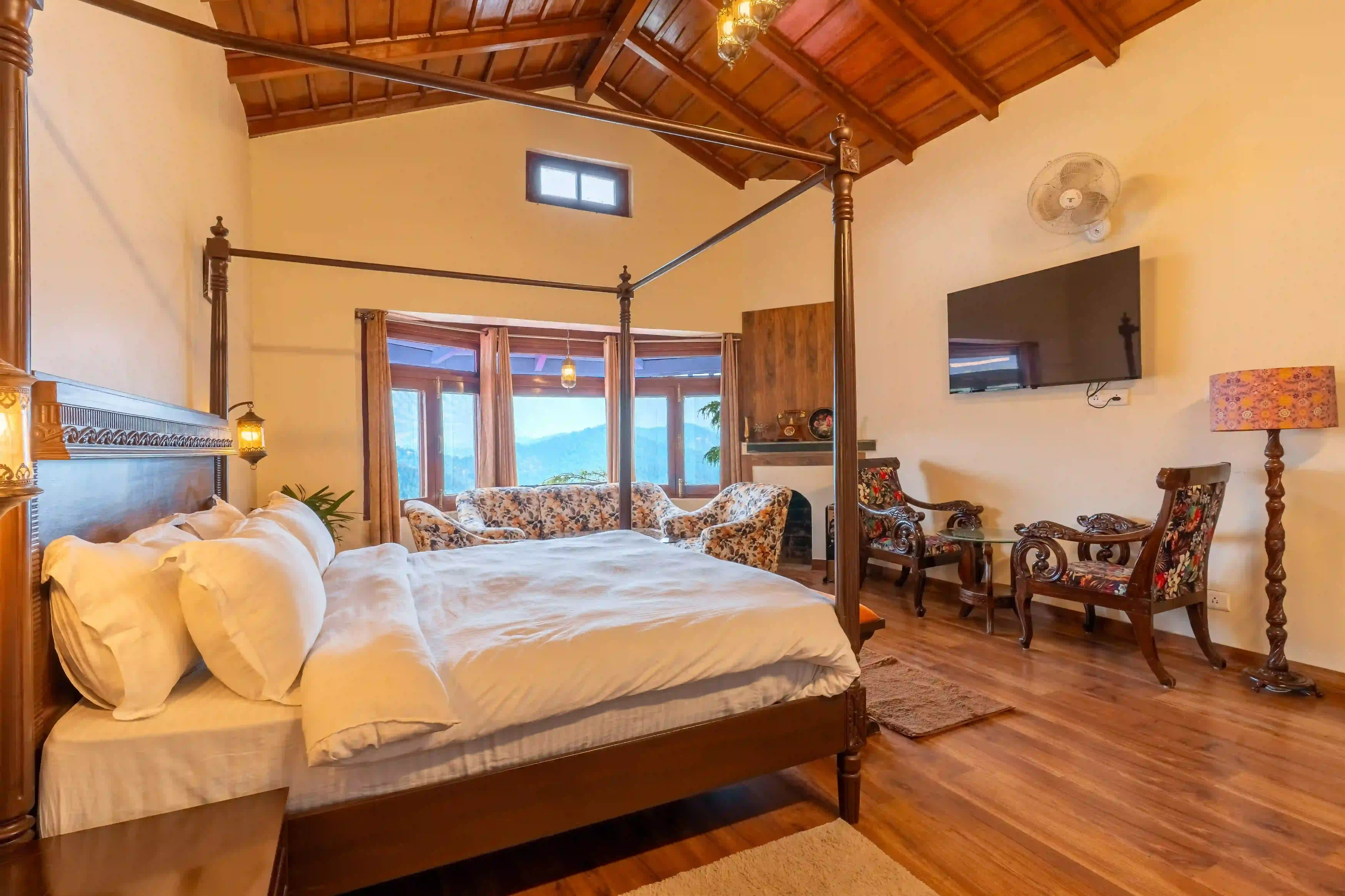 Luxurious Brass Room interior featuring a king-size bed and traditional Kumaoni architecture at Stone Heritage